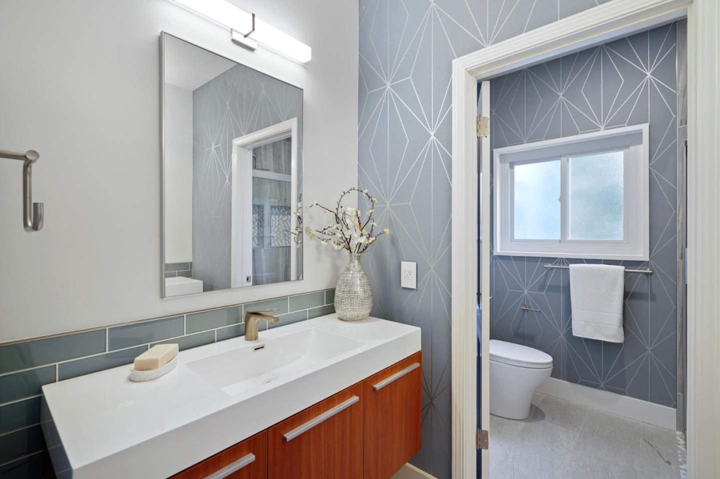 2312 Crest Lane Menlo Park, CA 94025 - Photo 20 of 34 a bathroom with a sink a toilet and a mirror