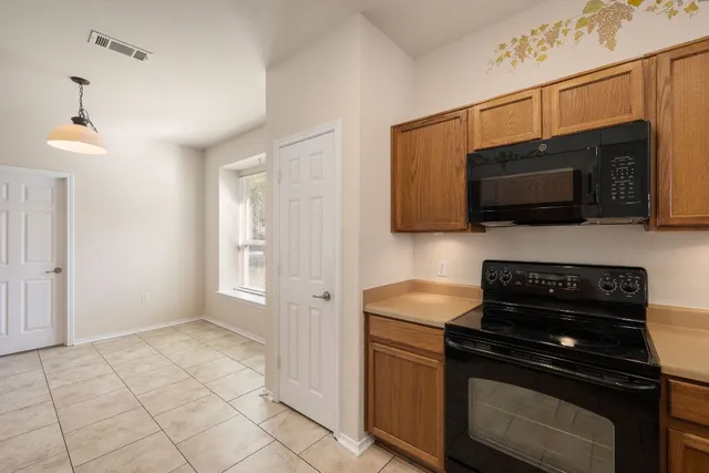 a kitchen with a stove and a microwave