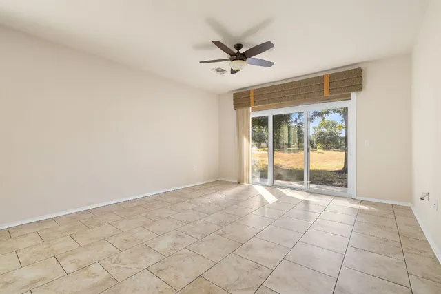 a view of an empty room and a window