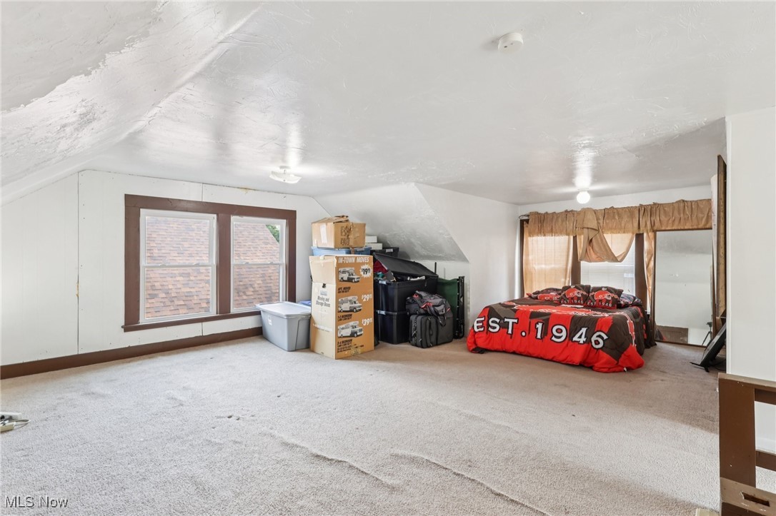 764 Chalker Street Akron, OH 44310 - Photo 21 of 34 Carpeted bedroom with vaulted ceiling