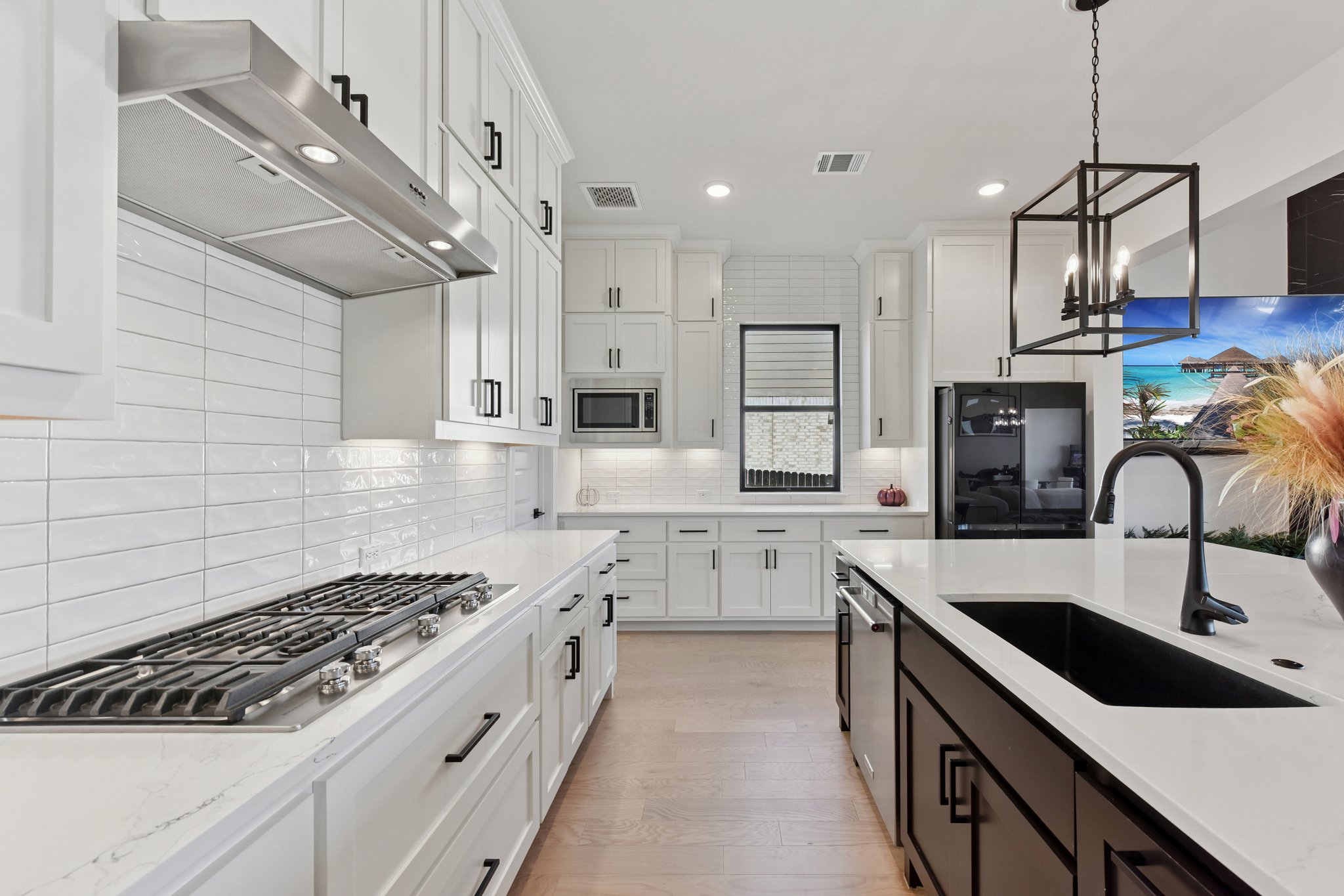 222 Rio Ranchero Road Georgetown, TX 78628 - Photo 13 of 40 a kitchen with stainless steel appliances granite countertop a sink a stove and cabinets