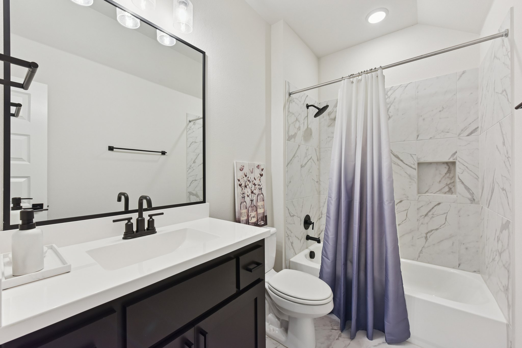 222 Rio Ranchero Road Georgetown, TX 78628 - Photo 21 of 40 a bathroom with a sink toilet and shower