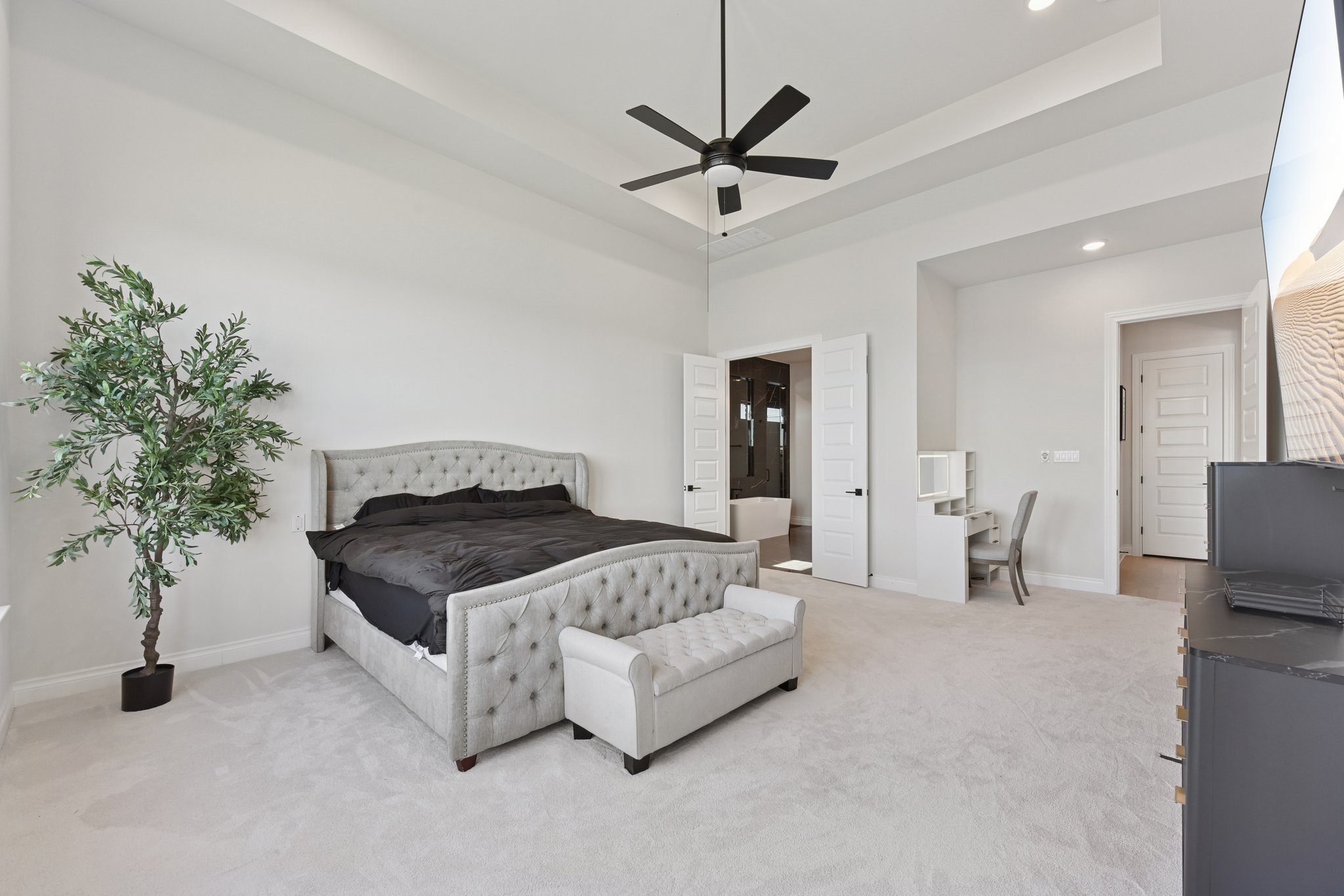 222 Rio Ranchero Road Georgetown, TX 78628 - Photo 26 of 40 a bedroom with a bed and a potted plant