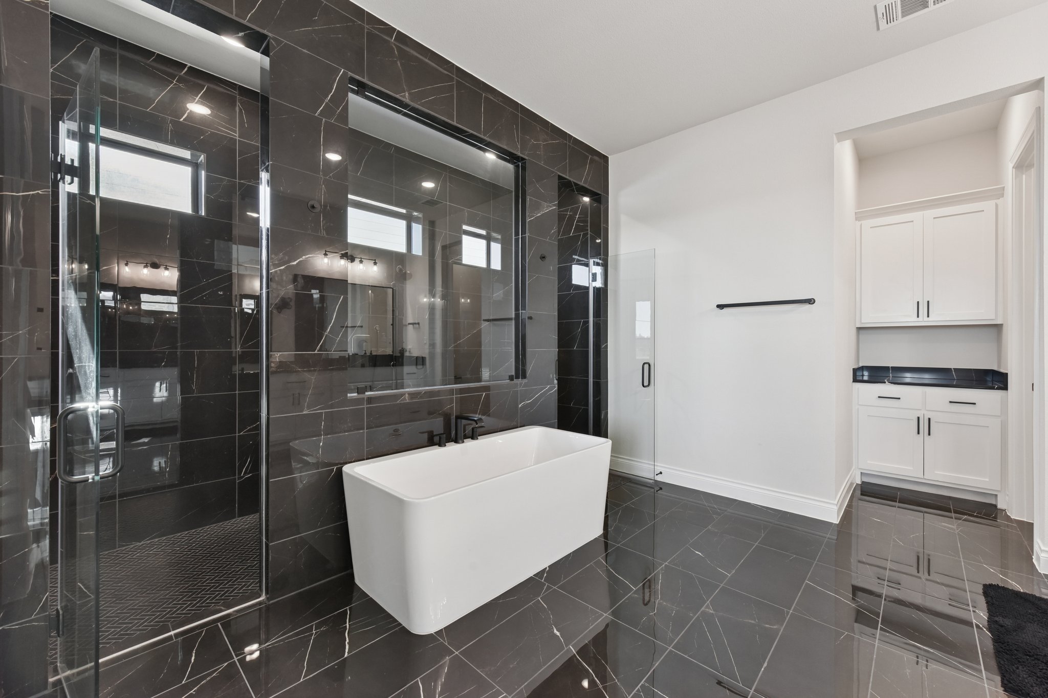 222 Rio Ranchero Road Georgetown, TX 78628 - Photo 29 of 40 a bathroom with a shower and a sink