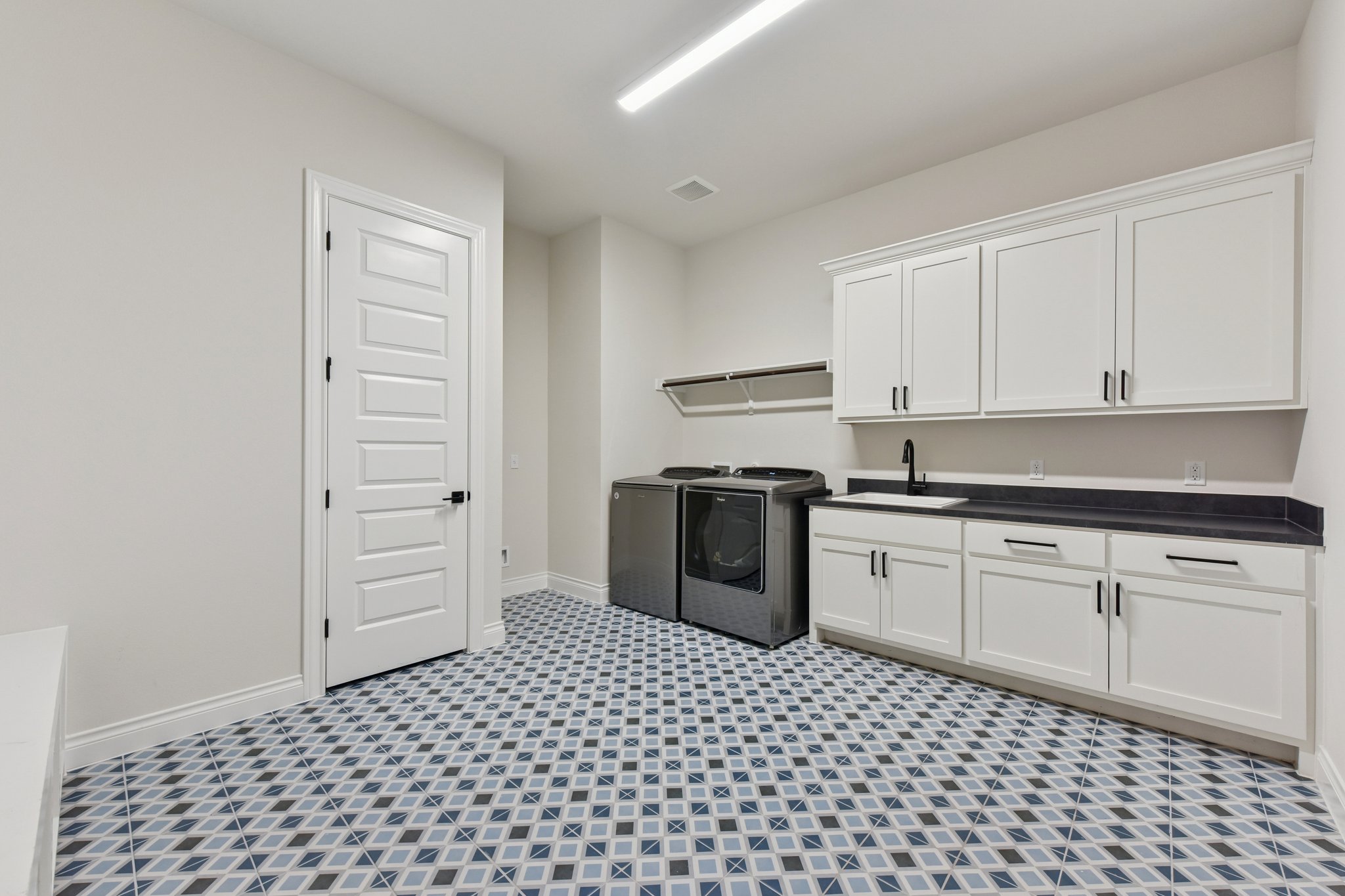 222 Rio Ranchero Road Georgetown, TX 78628 - Photo 35 of 40 a kitchen with a refrigerator stove and white cabinets