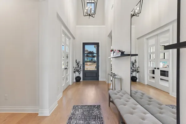 a view of a hallway view with wooden floor and staircase