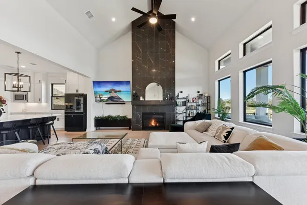 a living room with furniture and a fireplace