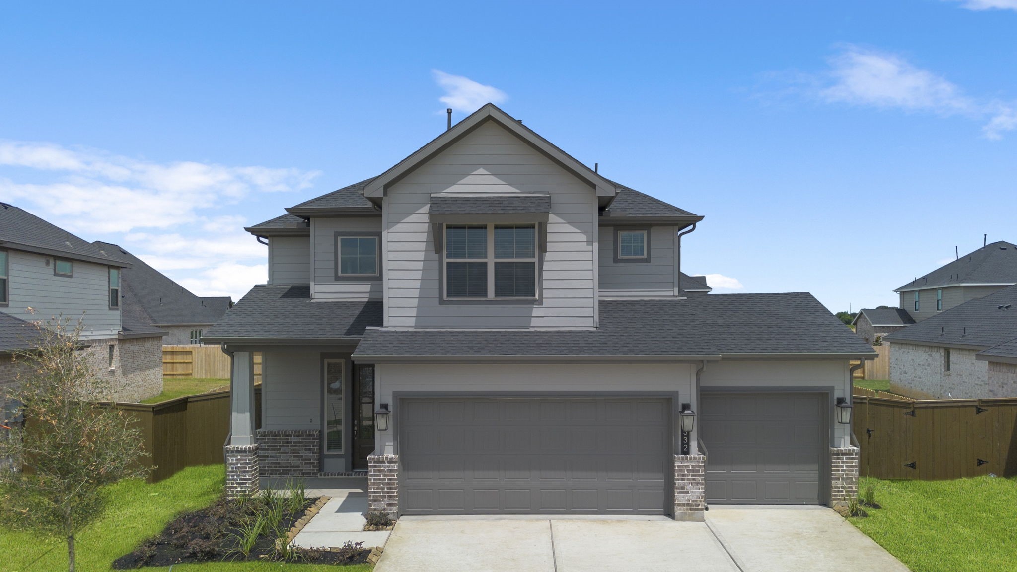 a front view of a house with garage