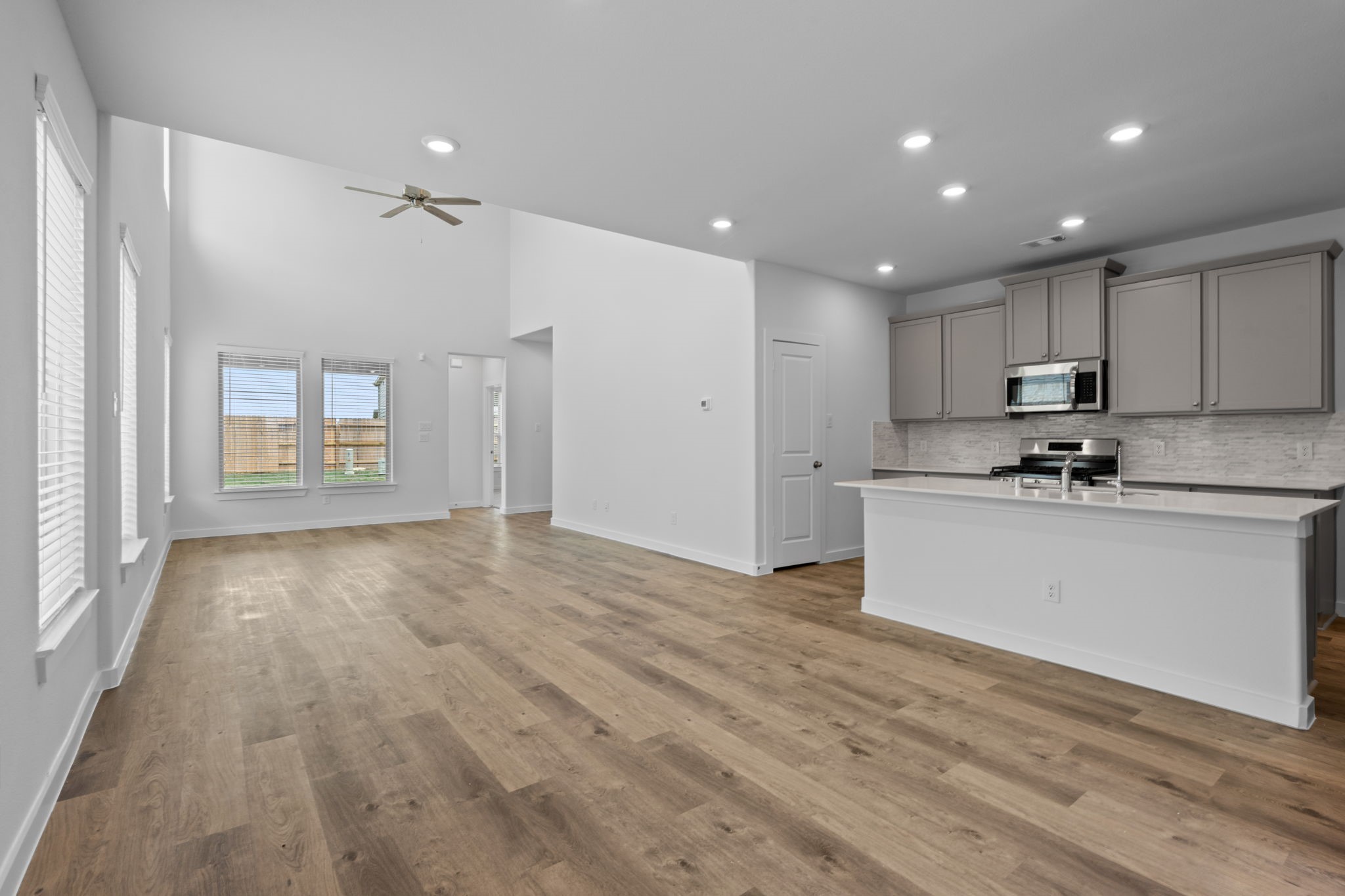 332 Gambels Quail Road Hempstead, TX 77445 - Photo 6 of 31 a view of a kitchen with a sink and dishwasher a refrigerator with wooden floor