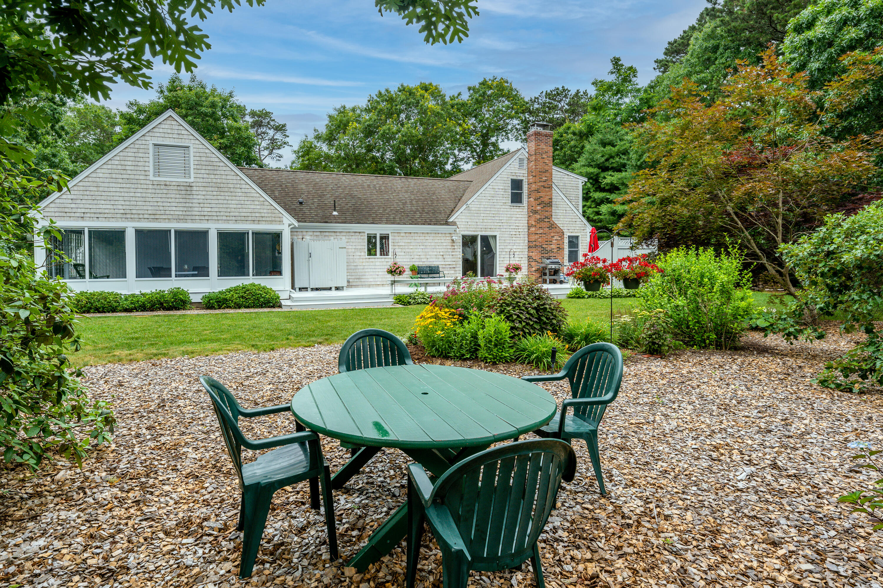4 Leaf Lane Eastham, MA 02642 - Photo 13 of 39 a view of a house with backyard and sitting area