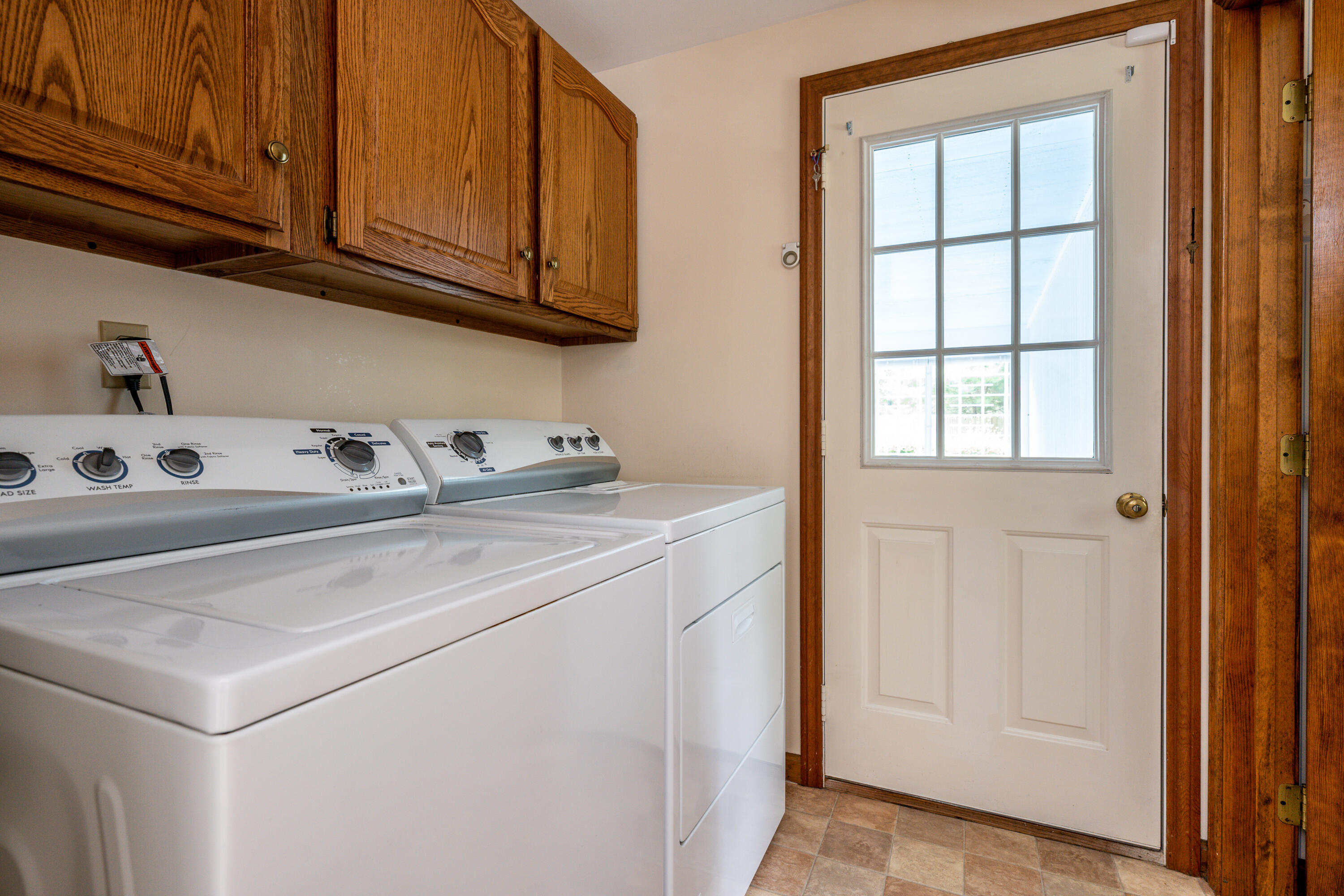 4 Leaf Lane Eastham, MA 02642 - Photo 18 of 39 a utility room with stainless steel appliances cabinets and a window