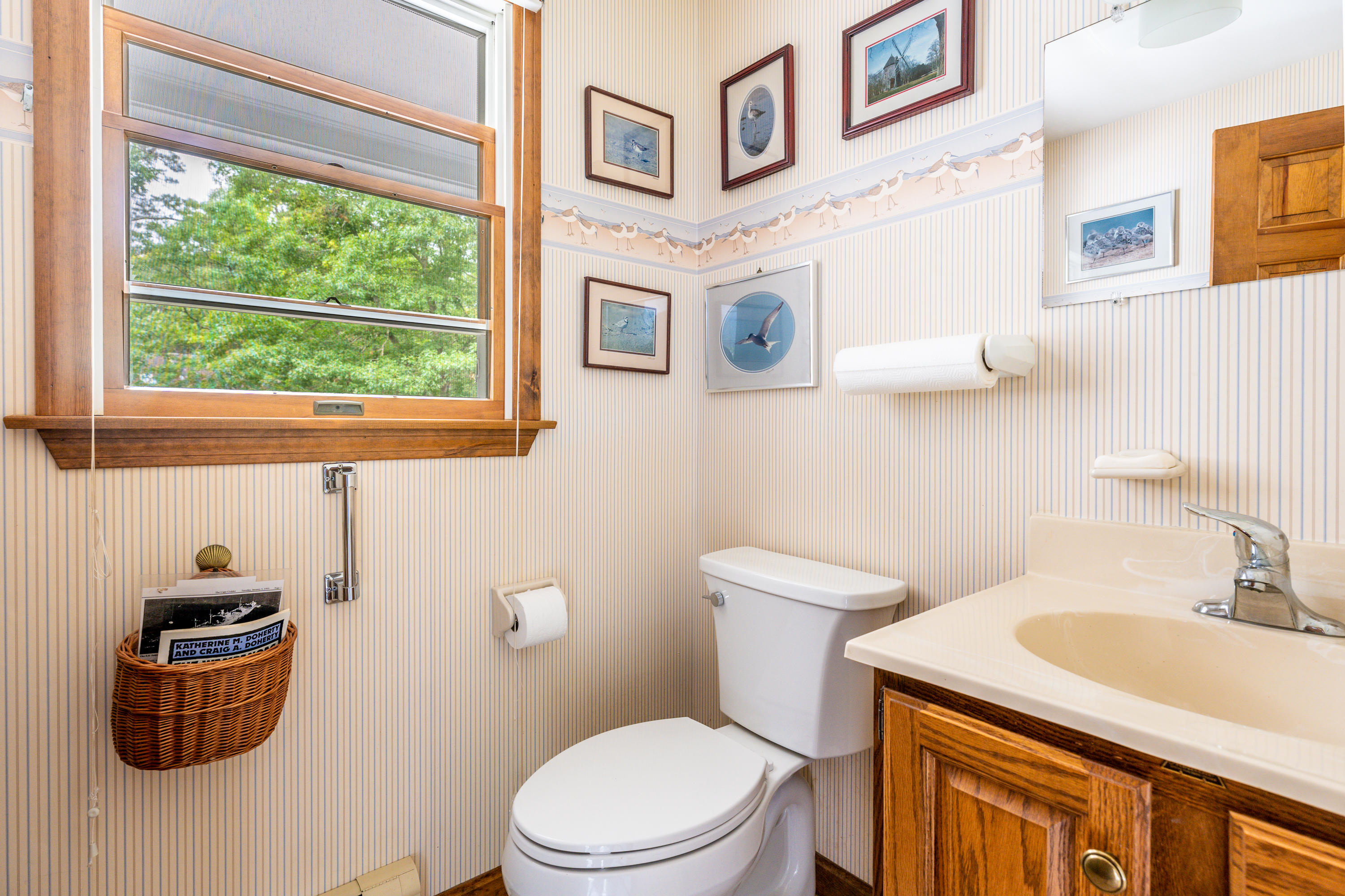4 Leaf Lane Eastham, MA 02642 - Photo 19 of 39 a bathroom with a sink a toilet and mirror