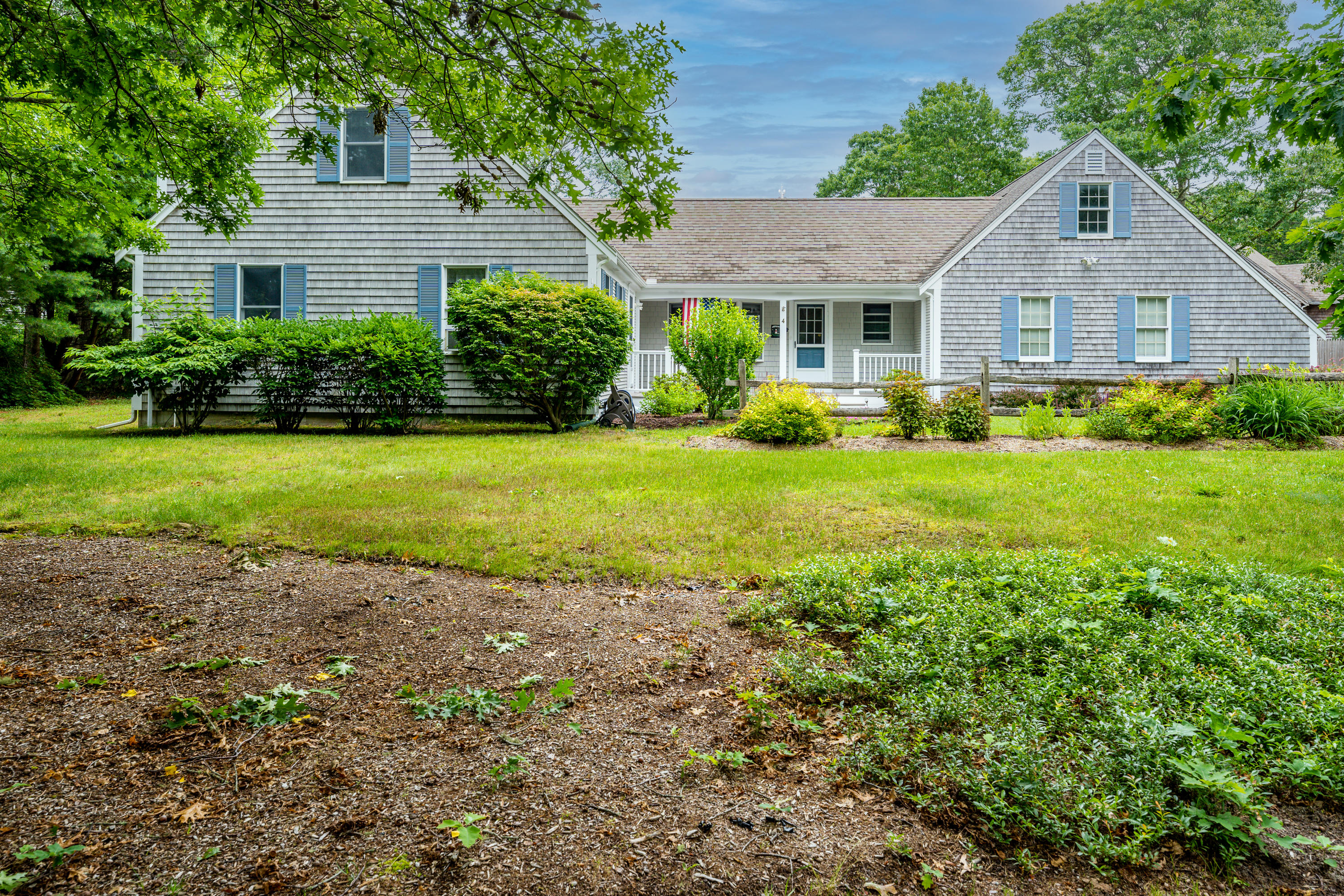 4 Leaf Lane Eastham, MA 02642 - Photo 2 of 39 a view of a house with yard and plants