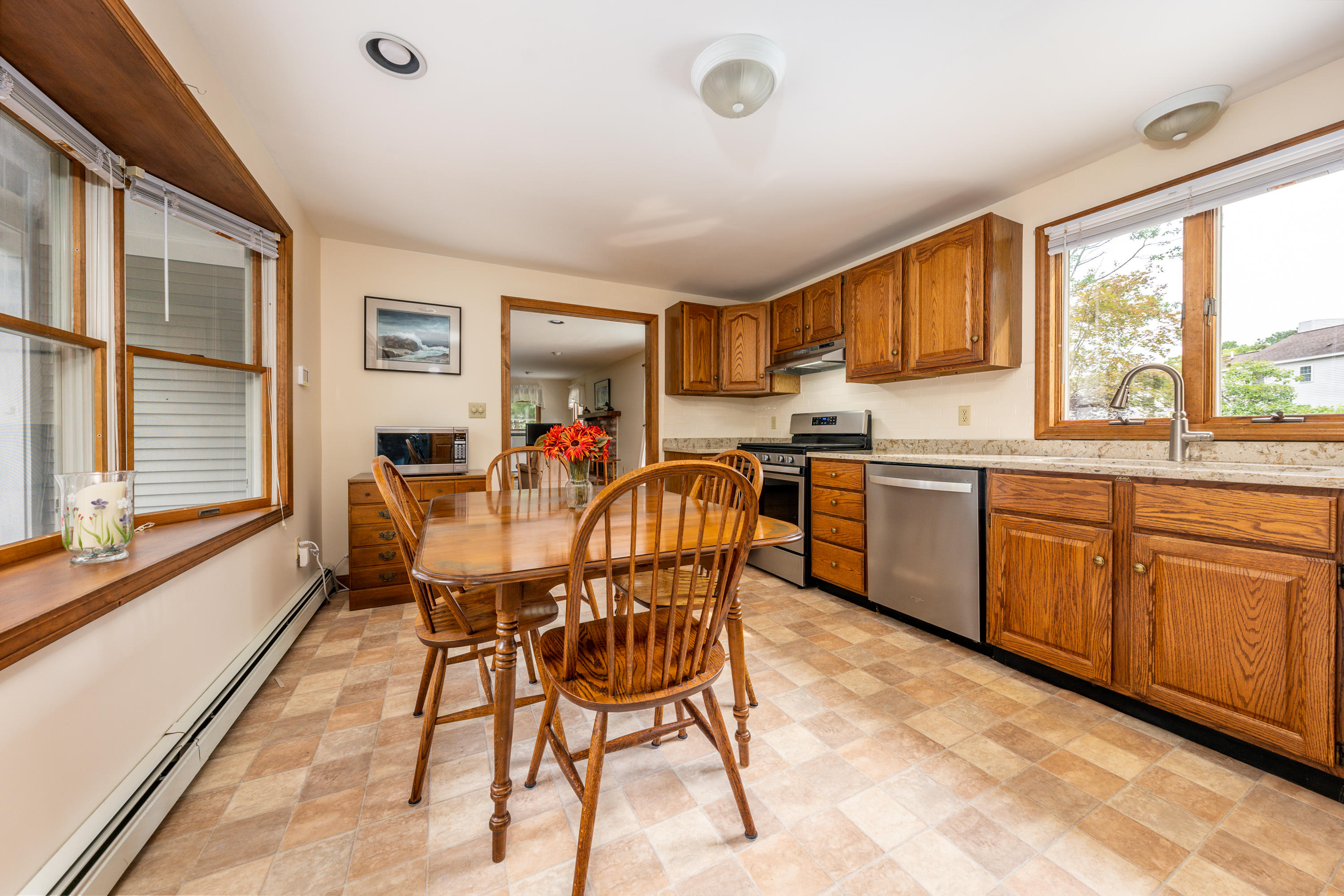 4 Leaf Lane Eastham, MA 02642 - Photo 22 of 39 a view of a dining room with furniture window and outside view