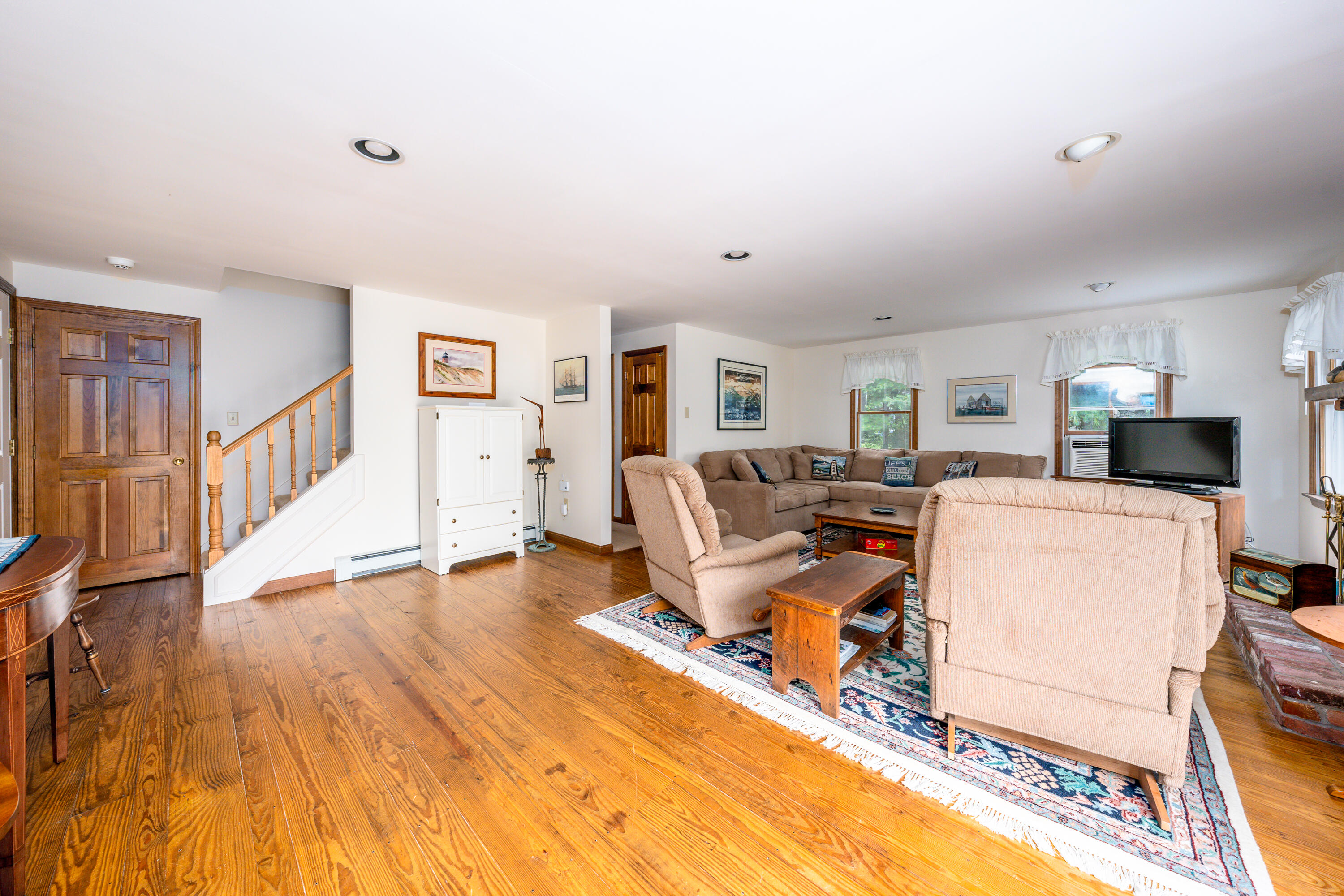 4 Leaf Lane Eastham, MA 02642 - Photo 23 of 39 a living room with furniture and a wooden floor