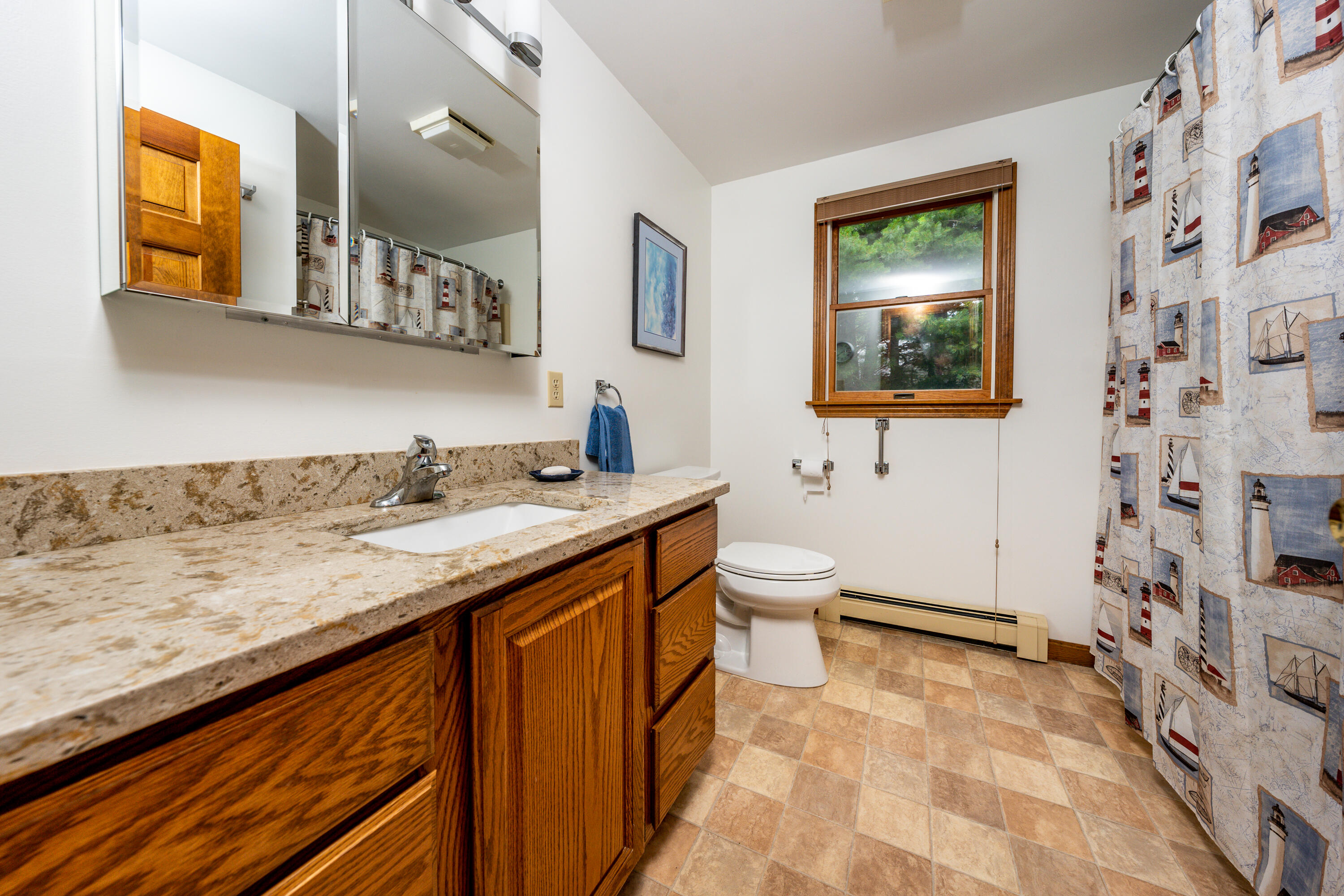 4 Leaf Lane Eastham, MA 02642 - Photo 28 of 39 a bathroom with a granite countertop sink mirror vanity and toilet