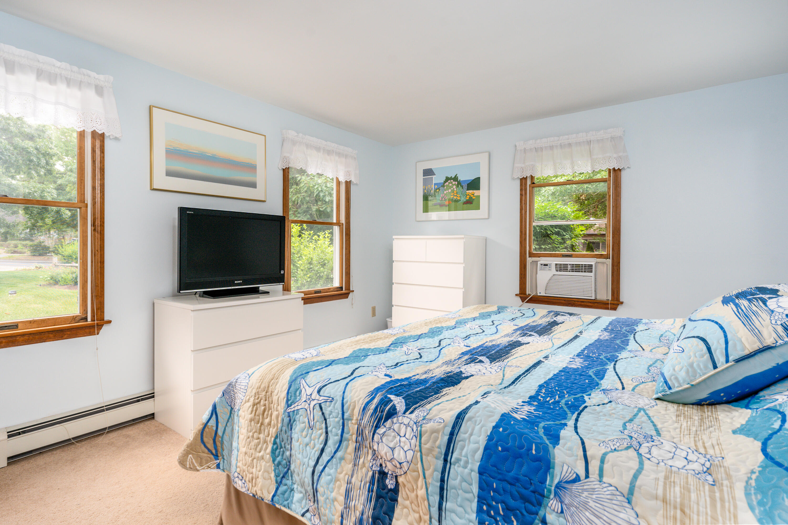 4 Leaf Lane Eastham, MA 02642 - Photo 31 of 39 a bedroom with a bed and a flat screen tv