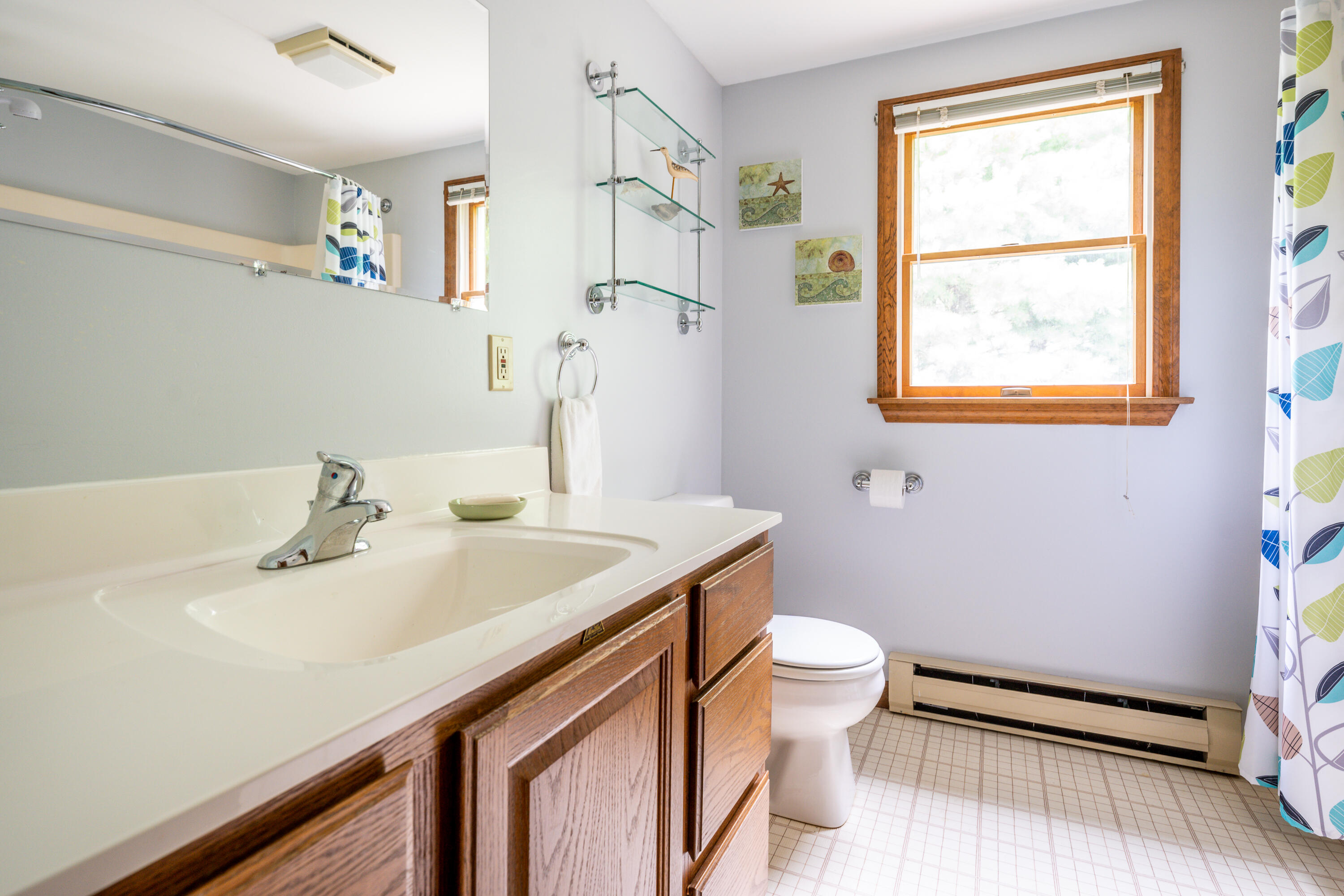 4 Leaf Lane Eastham, MA 02642 - Photo 34 of 39 a bathroom with a sink a toilet and a window