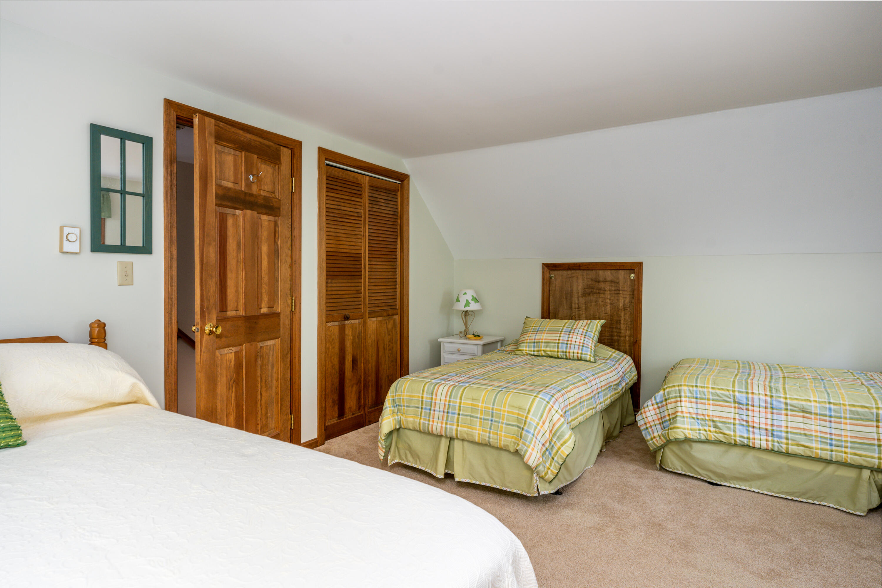 4 Leaf Lane Eastham, MA 02642 - Photo 39 of 39 a bedroom with a bed and wooden floor