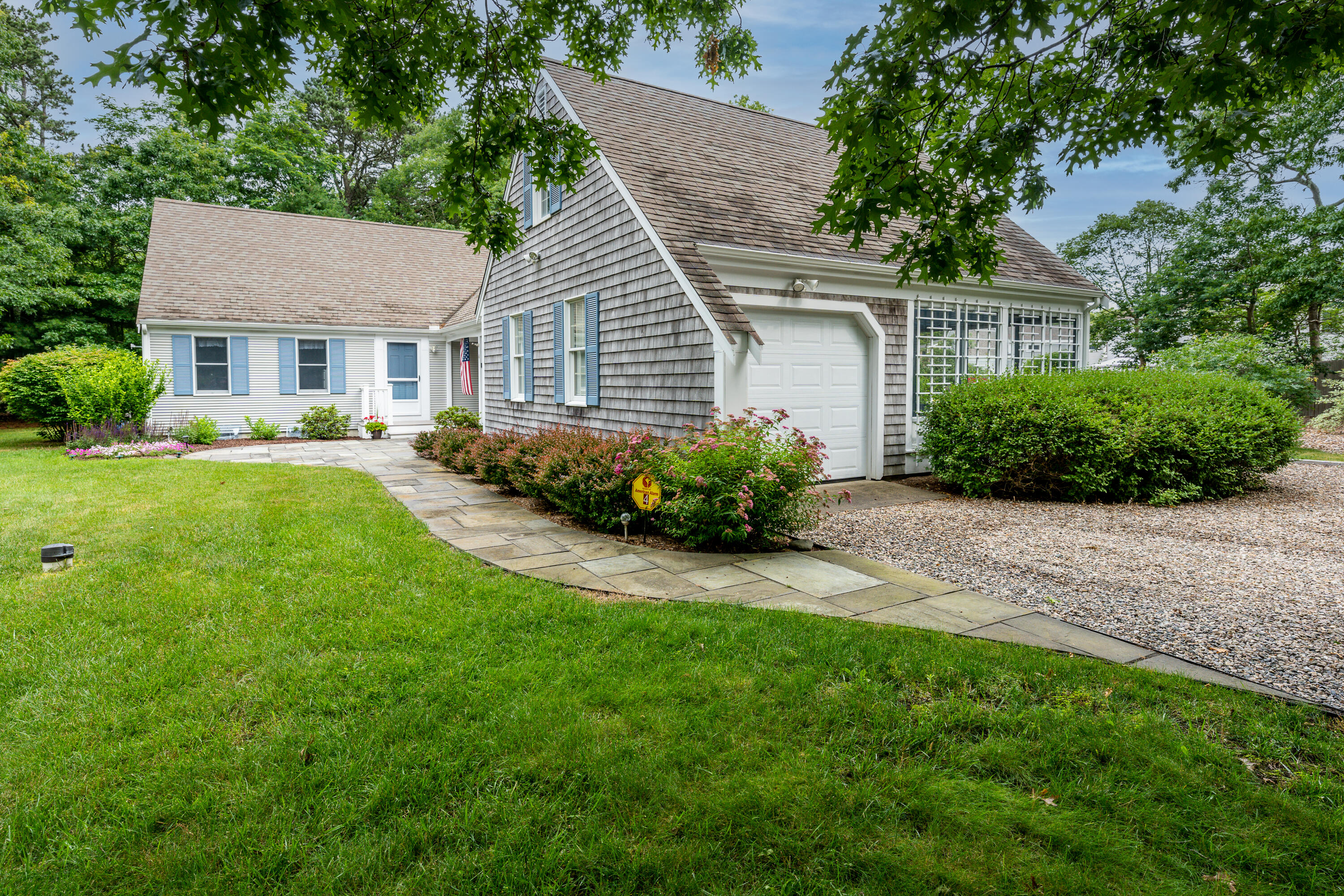 4 Leaf Lane Eastham, MA 02642 - Photo 5 of 39 a front view of a house with a garden