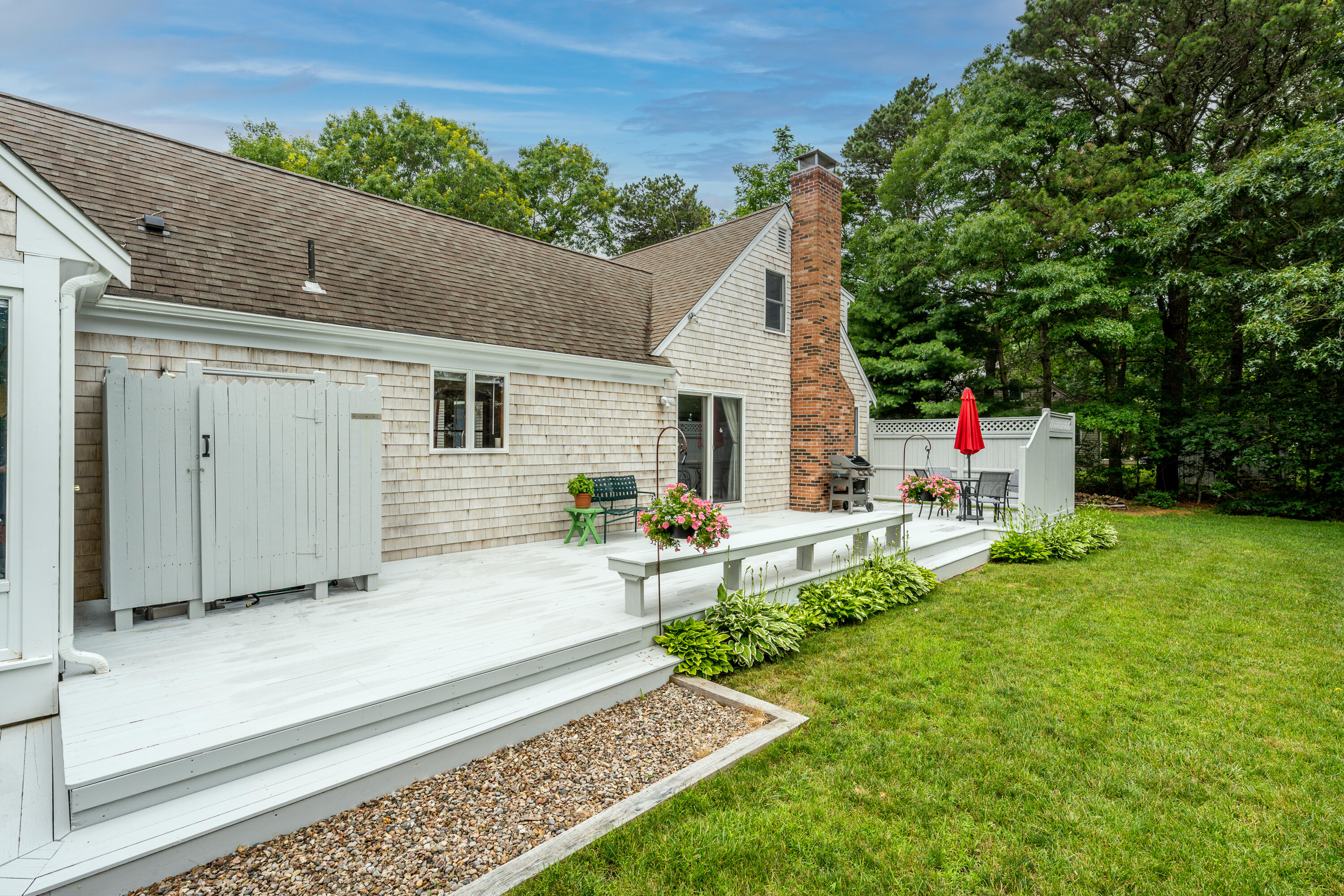 4 Leaf Lane Eastham, MA 02642 - Photo 8 of 39 a view of backyard with a garden and entertaining space