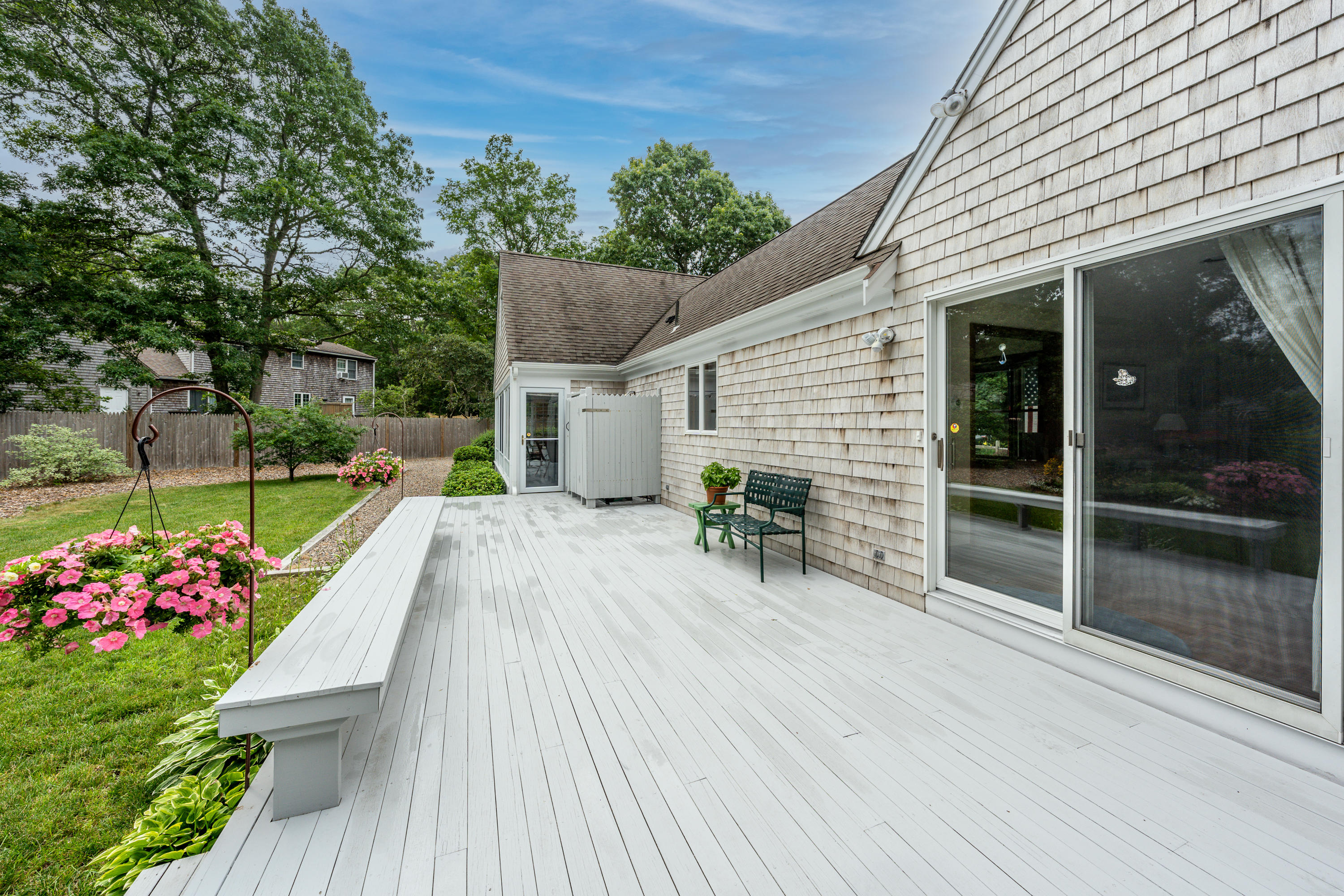 4 Leaf Lane Eastham, MA 02642 - Photo 10 of 39 a view of a house with backyard and sitting area