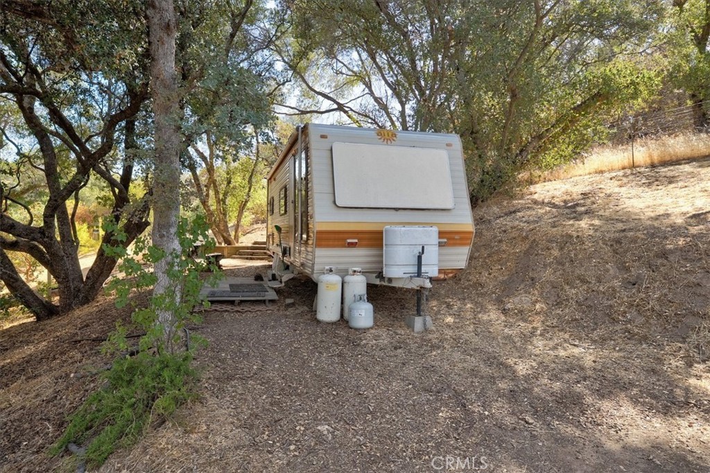 3279 Quail Run Road Mariposa, CA 95338 - Photo 12 of 41 a backyard of a house with barbeque oven and outdoor seating