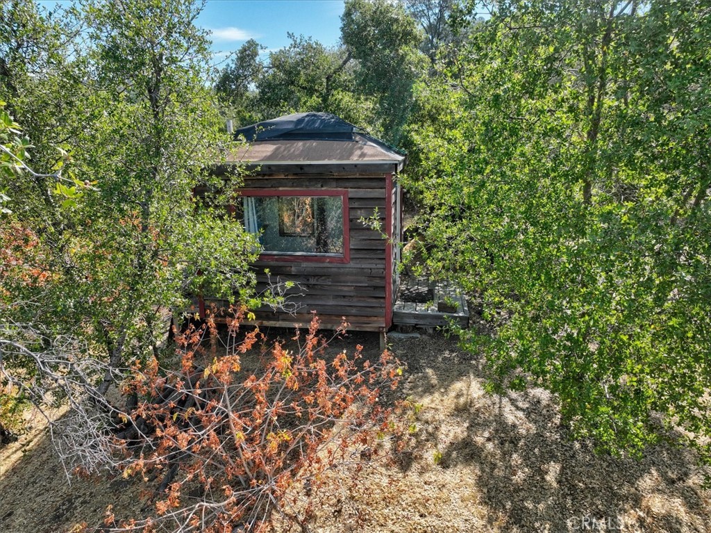 3279 Quail Run Road Mariposa, CA 95338 - Photo 28 of 41 a garden view with a bench