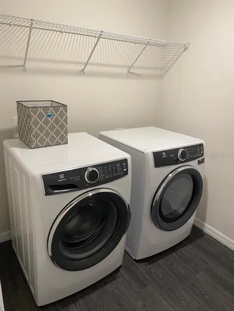 a utility room with dryer and washer