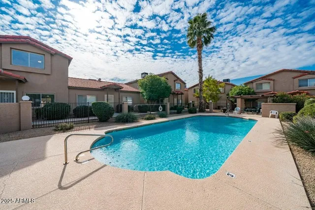 a view of a swimming pool with a patio