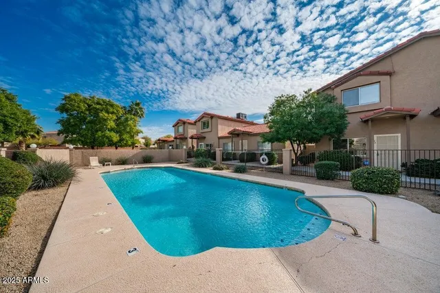 a view of a swimming pool with a patio