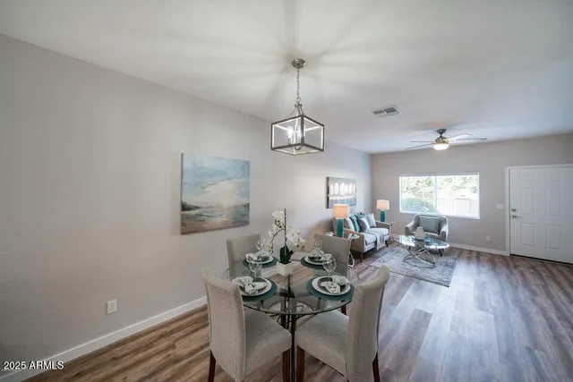 a view of a dining room with furniture window and wooden floor