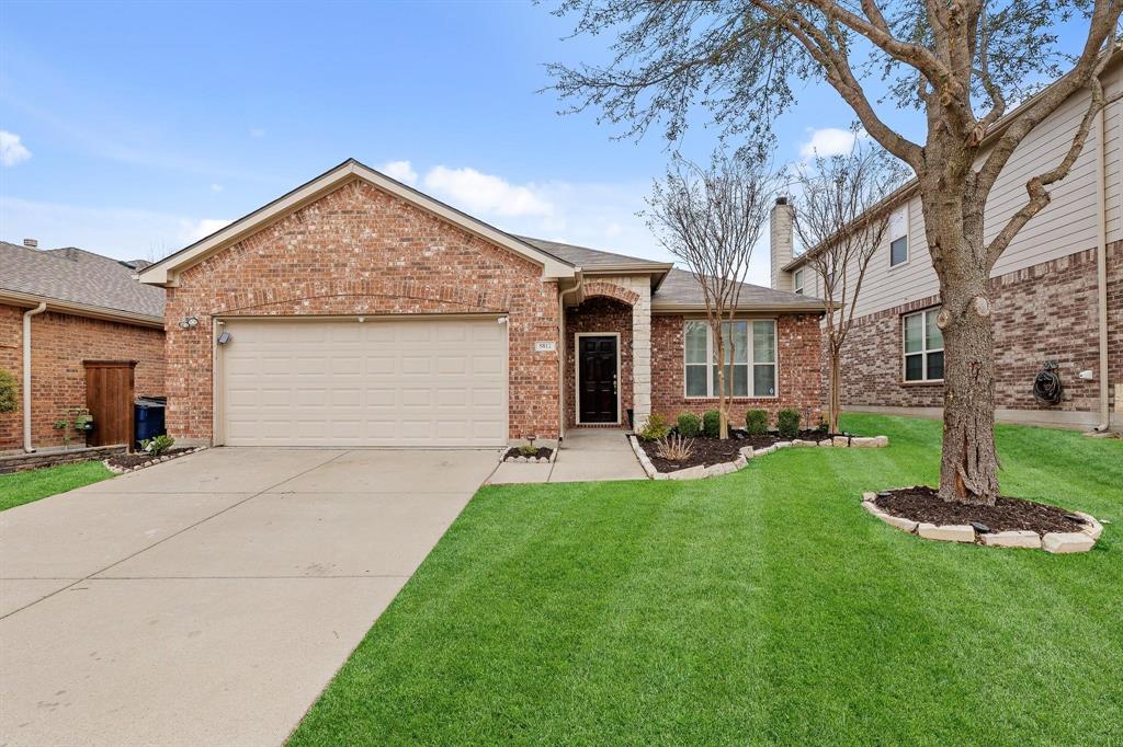 5812 Pebble Ridge Drive McKinney, TX 75070 - Photo 1 of 29 a front view of a house with a yard and garage