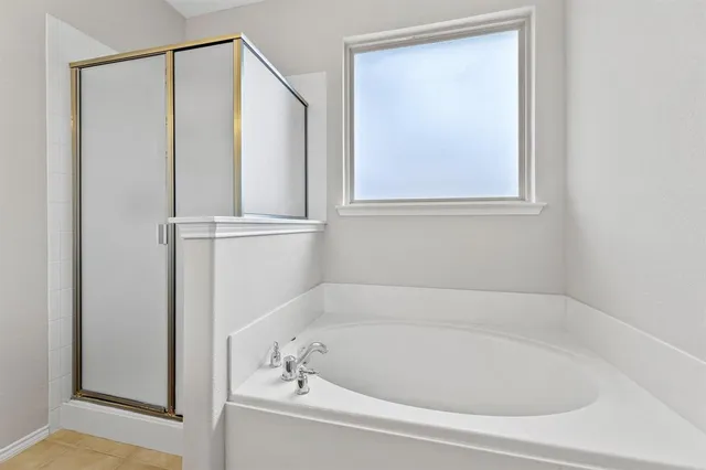 a white bath tub sitting next to a window
