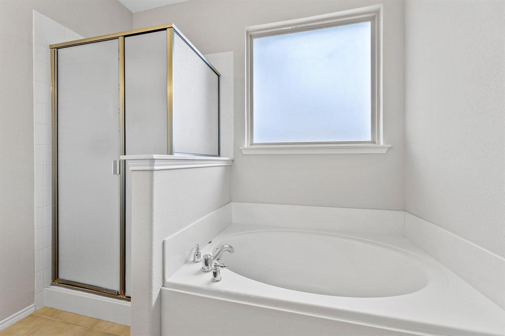 5812 Pebble Ridge Drive McKinney, TX 75070 - Photo 15 of 29 a white bath tub sitting next to a window