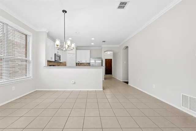 a view of a kitchen with a sink and cabinets