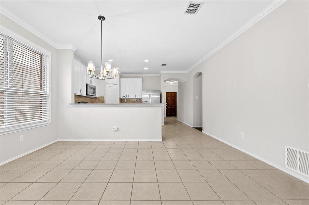 5812 Pebble Ridge Drive McKinney, TX 75070 - Photo 23 of 29 a view of a kitchen with a sink and cabinets