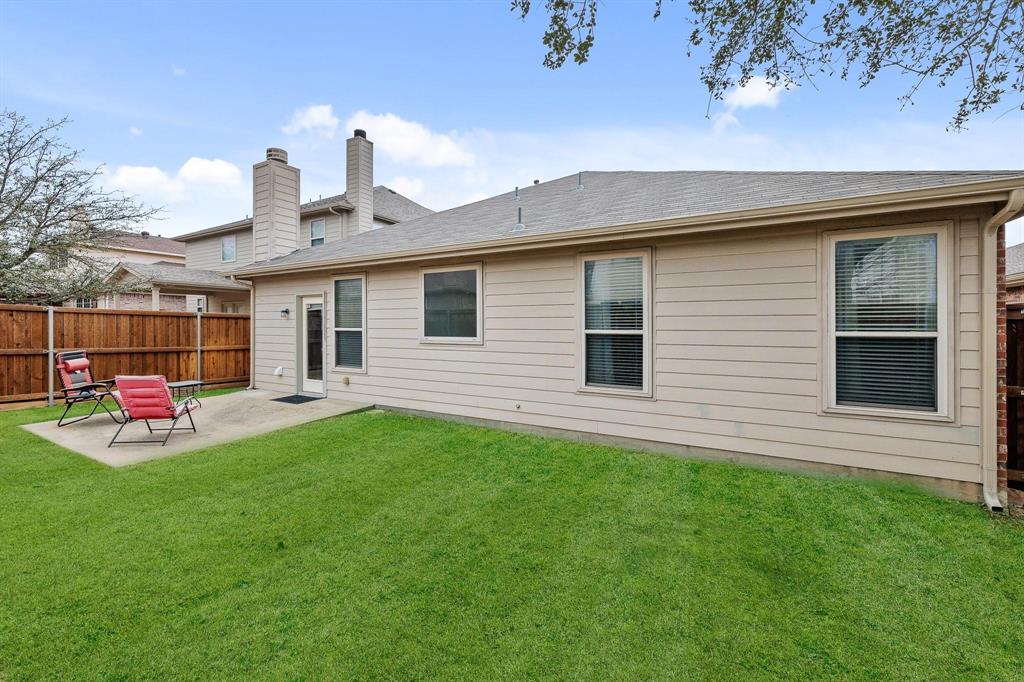 5812 Pebble Ridge Drive McKinney, TX 75070 - Photo 28 of 29 a front view of a house with a garden and deck