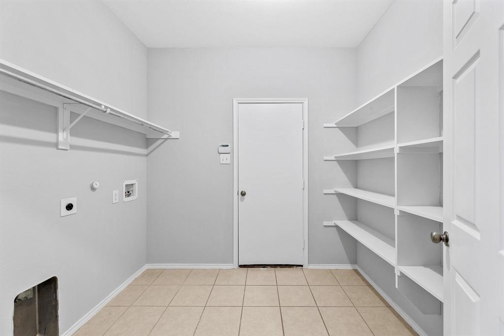 5812 Pebble Ridge Drive McKinney, TX 75070 - Photo 5 of 29 a view of an empty walk in closet