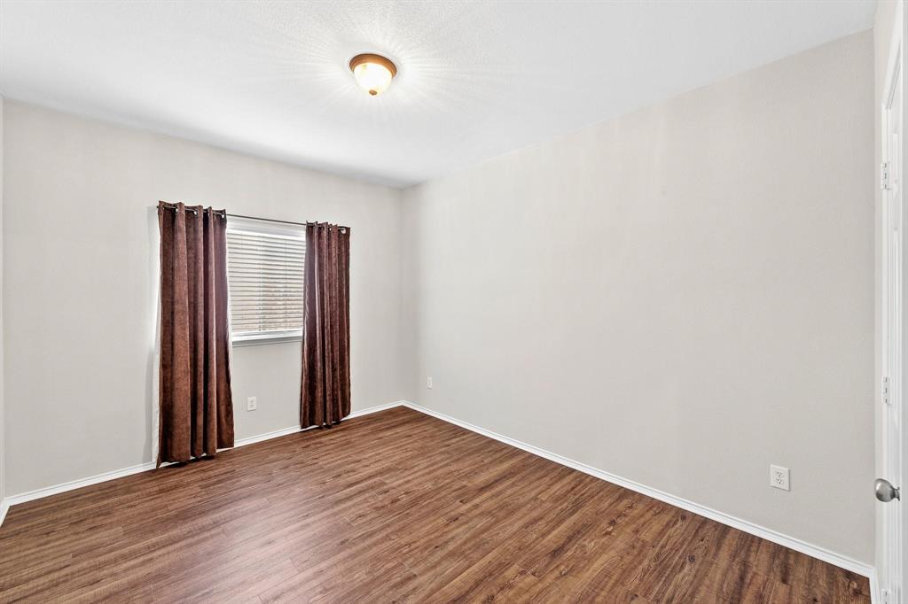 5812 Pebble Ridge Drive McKinney, TX 75070 - Photo 8 of 29 a view of empty room with wooden floor