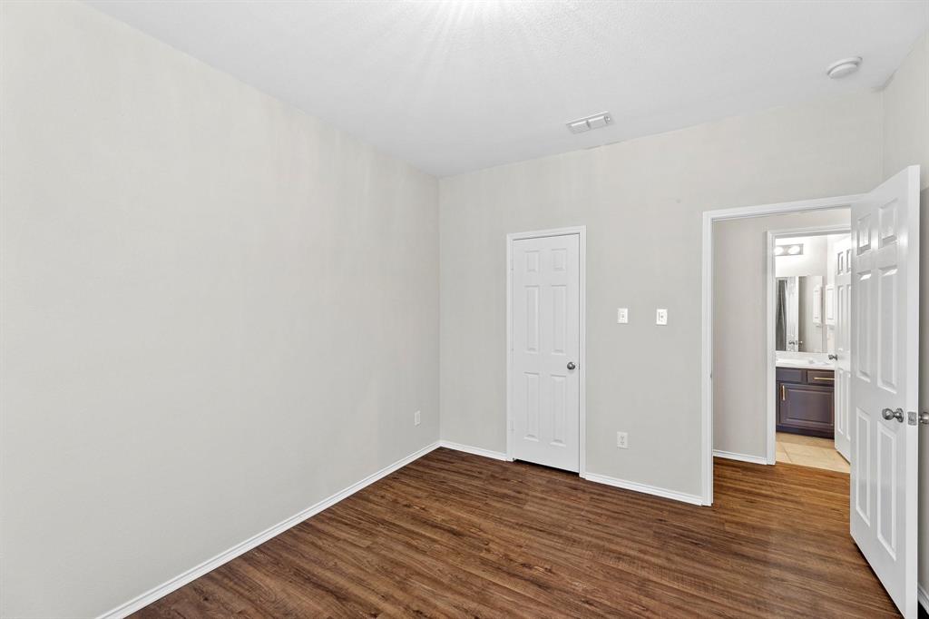 5812 Pebble Ridge Drive McKinney, TX 75070 - Photo 9 of 29 a view of a room with wooden floor and brick walls