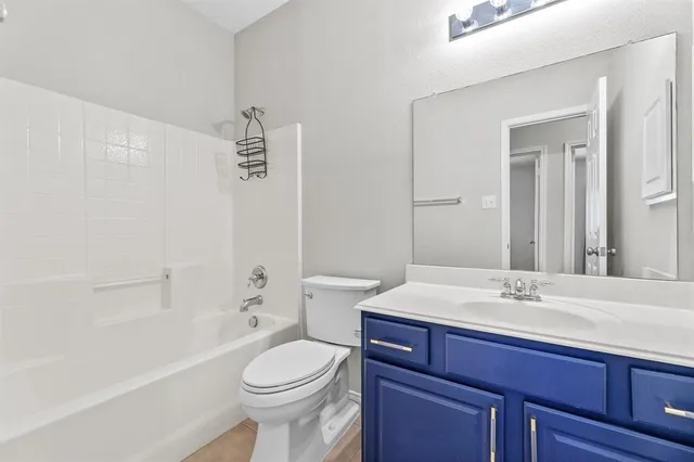 a bathroom with a sink a toilet and a bathtub