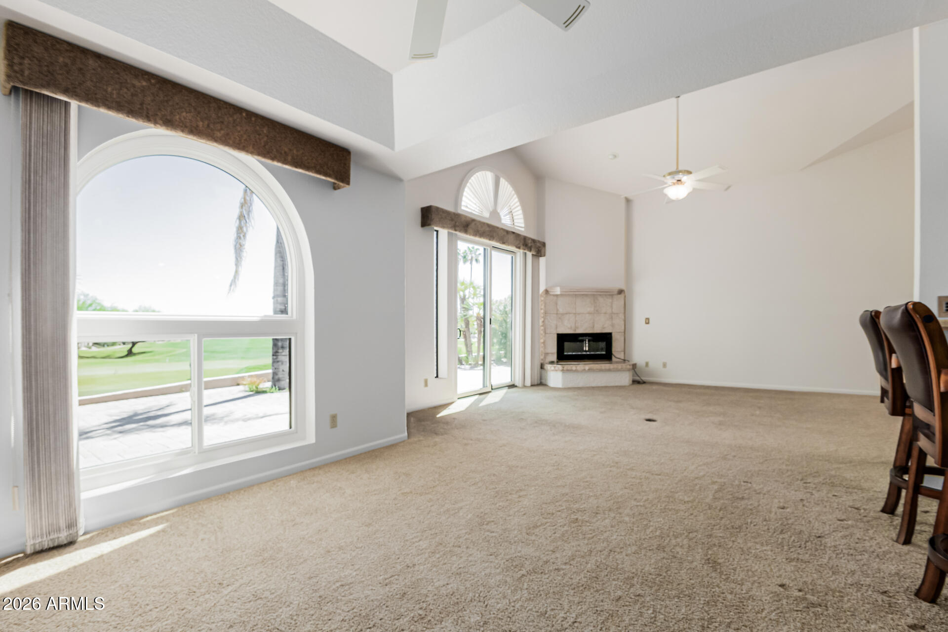 25615 North Bolero Bend, Unit 5 Rio Verde, AZ 85263 - Photo 11 of 57 a view of an empty room with a fireplace and a window