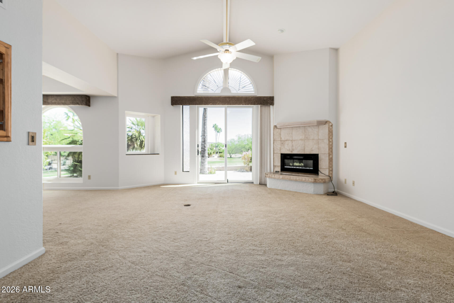 25615 North Bolero Bend, Unit 5 Rio Verde, AZ 85263 - Photo 13 of 57 an empty room with windows and fireplace