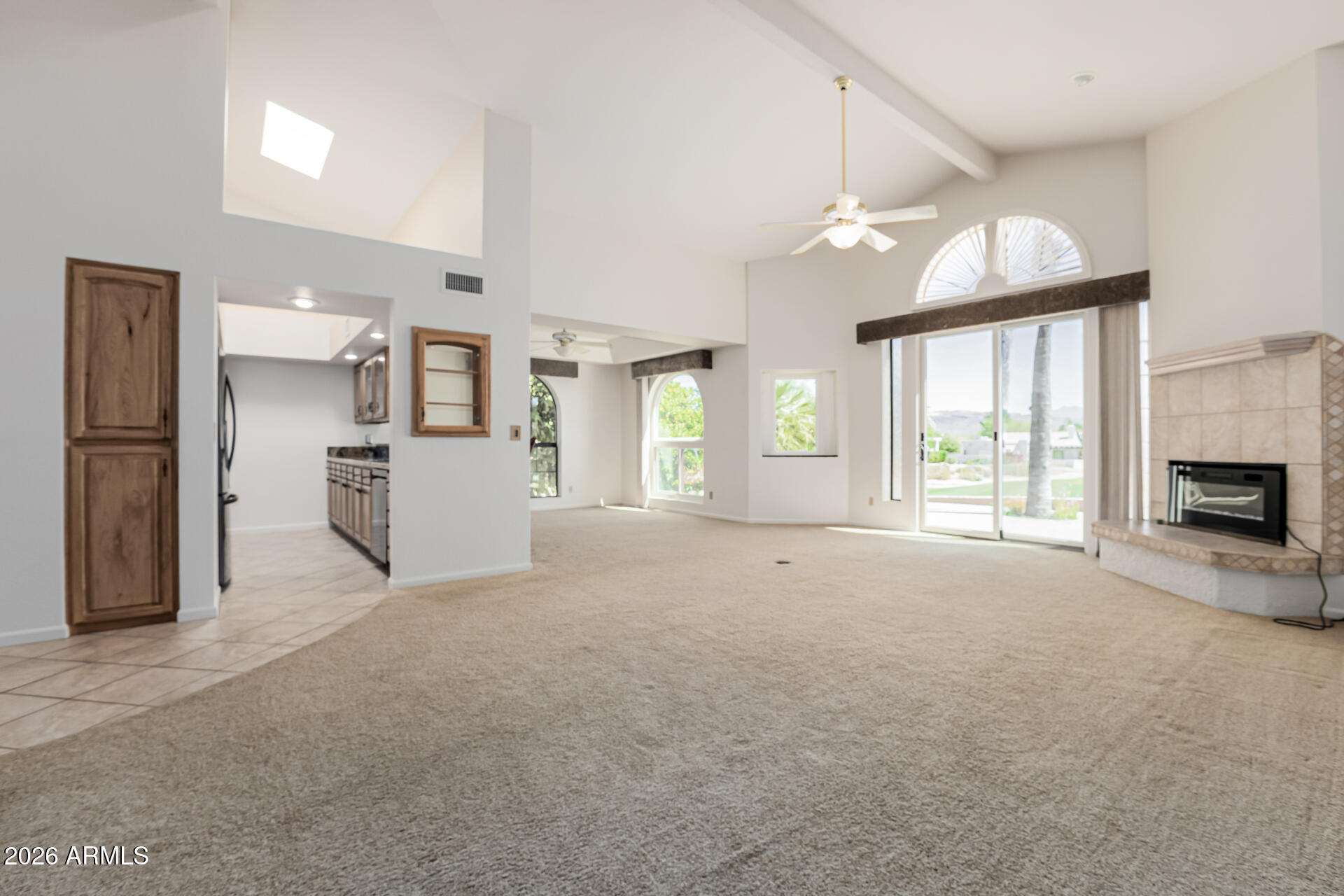 25615 North Bolero Bend, Unit 5 Rio Verde, AZ 85263 - Photo 14 of 57 a view of empty room with a fireplace and window