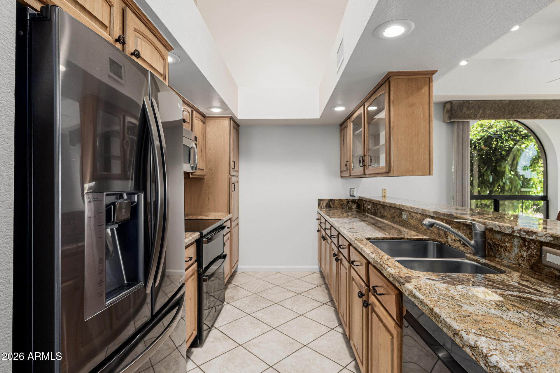 25615 North Bolero Bend, Unit 5 Rio Verde, AZ 85263 - Photo 16 of 57 a kitchen that has a sink a stove and a refrigerator