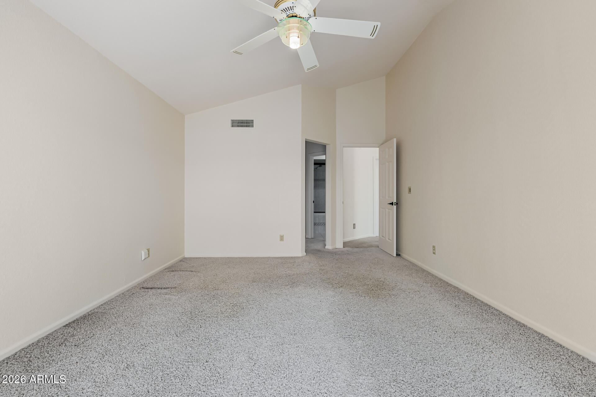 25615 North Bolero Bend, Unit 5 Rio Verde, AZ 85263 - Photo 21 of 57 an empty room with a ceiling fan and a window