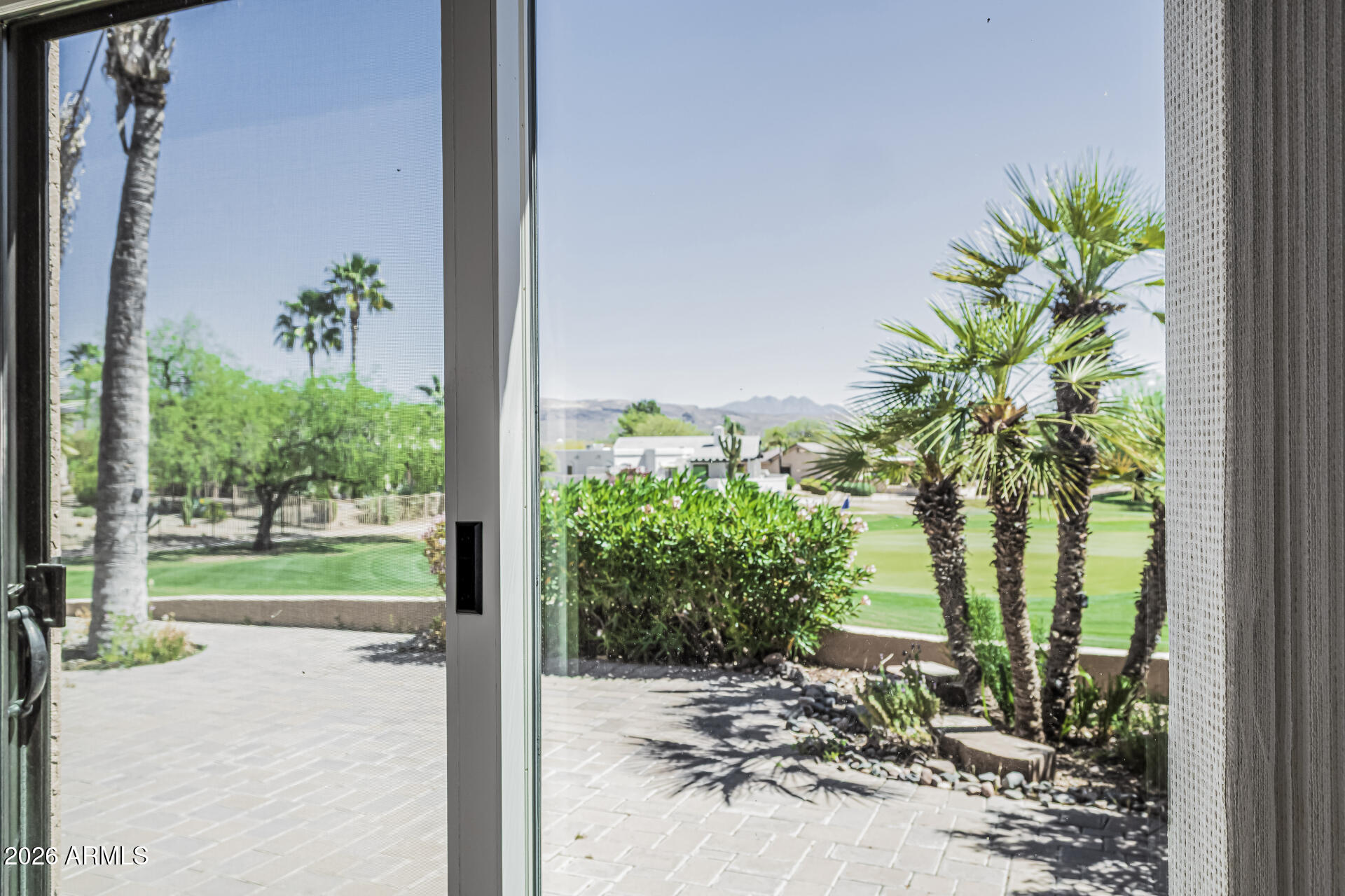 25615 North Bolero Bend, Unit 5 Rio Verde, AZ 85263 - Photo 22 of 57 a view of a porch with chairs and potted plants