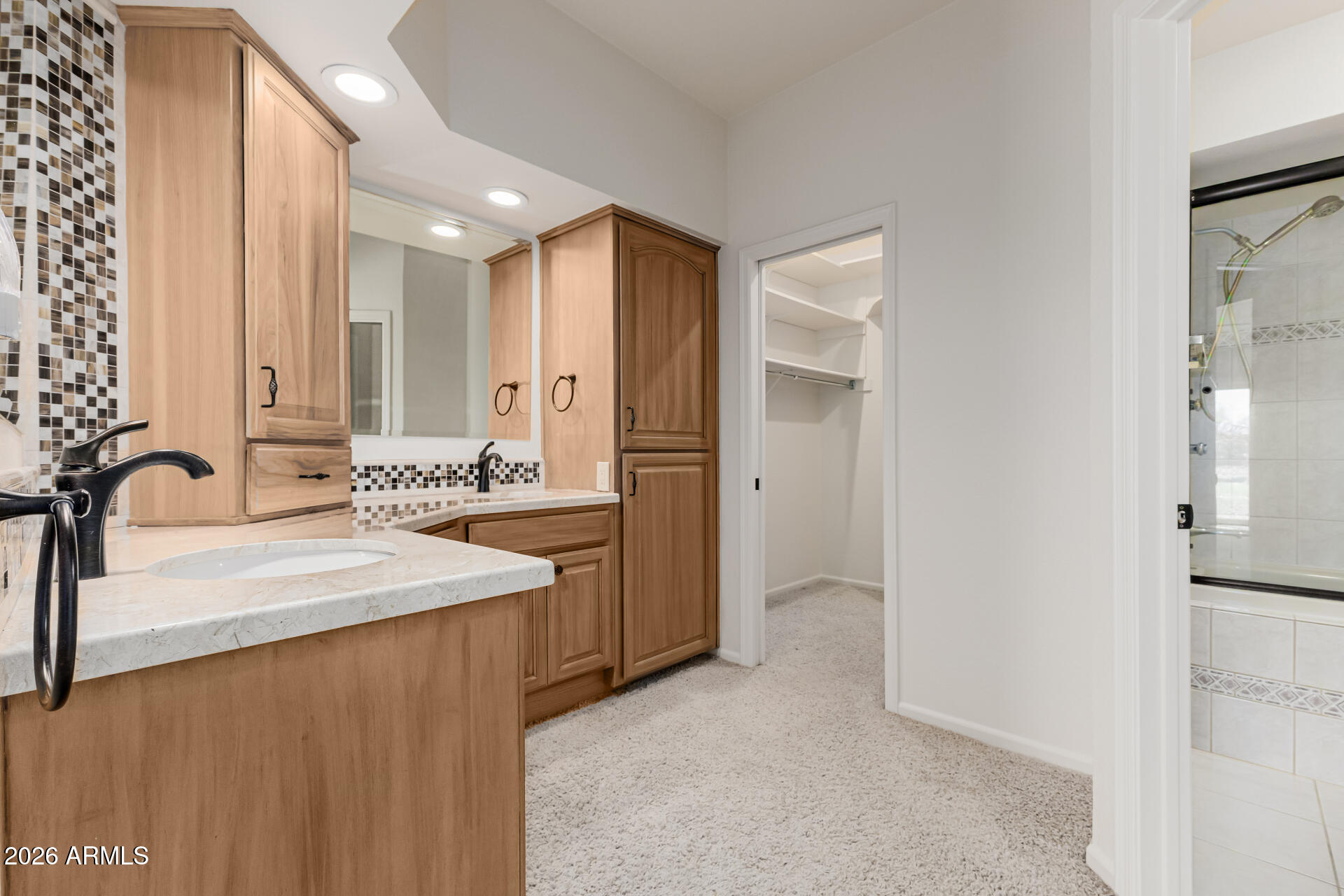 25615 North Bolero Bend, Unit 5 Rio Verde, AZ 85263 - Photo 24 of 57 a spacious bathroom with a double vanity sink and a mirror