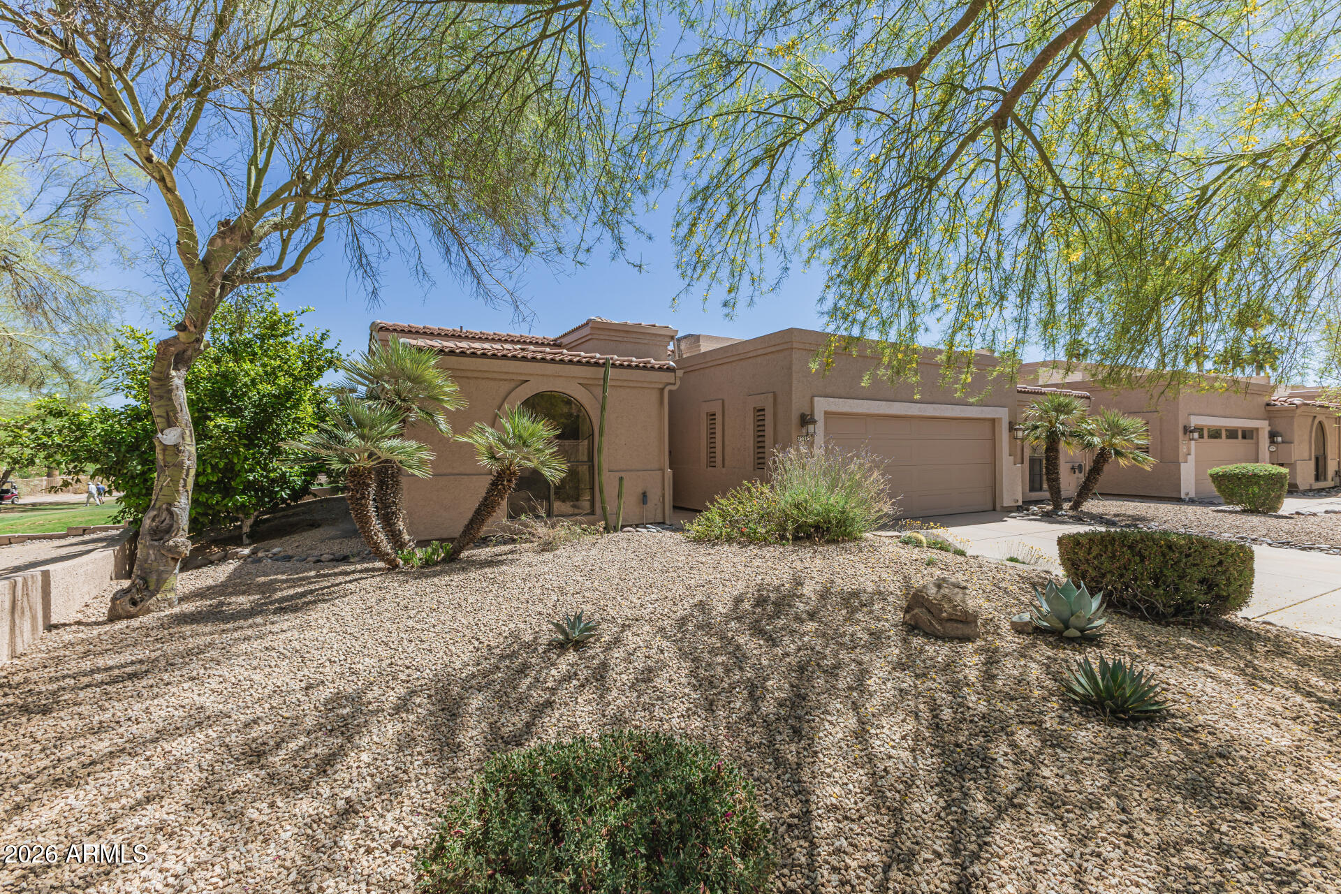 25615 North Bolero Bend, Unit 5 Rio Verde, AZ 85263 - Photo 4 of 57 a view of a chair and fire pit in front of a house
